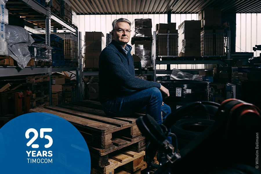 Wilhelm Dallmann, CEO at Dallmaco Speditionsgesellschaft mbH, sits in his warehouse surrounded by racks and palettes.