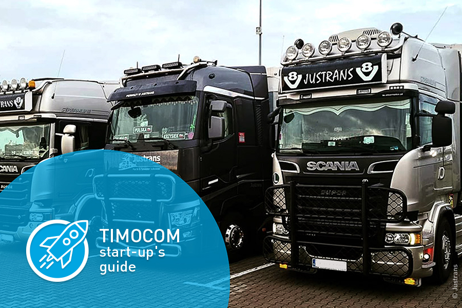 The image shows three black trucks that belong to TIMOCOM customer TSL Justrans s.c., parked next to one another. The words “TIM