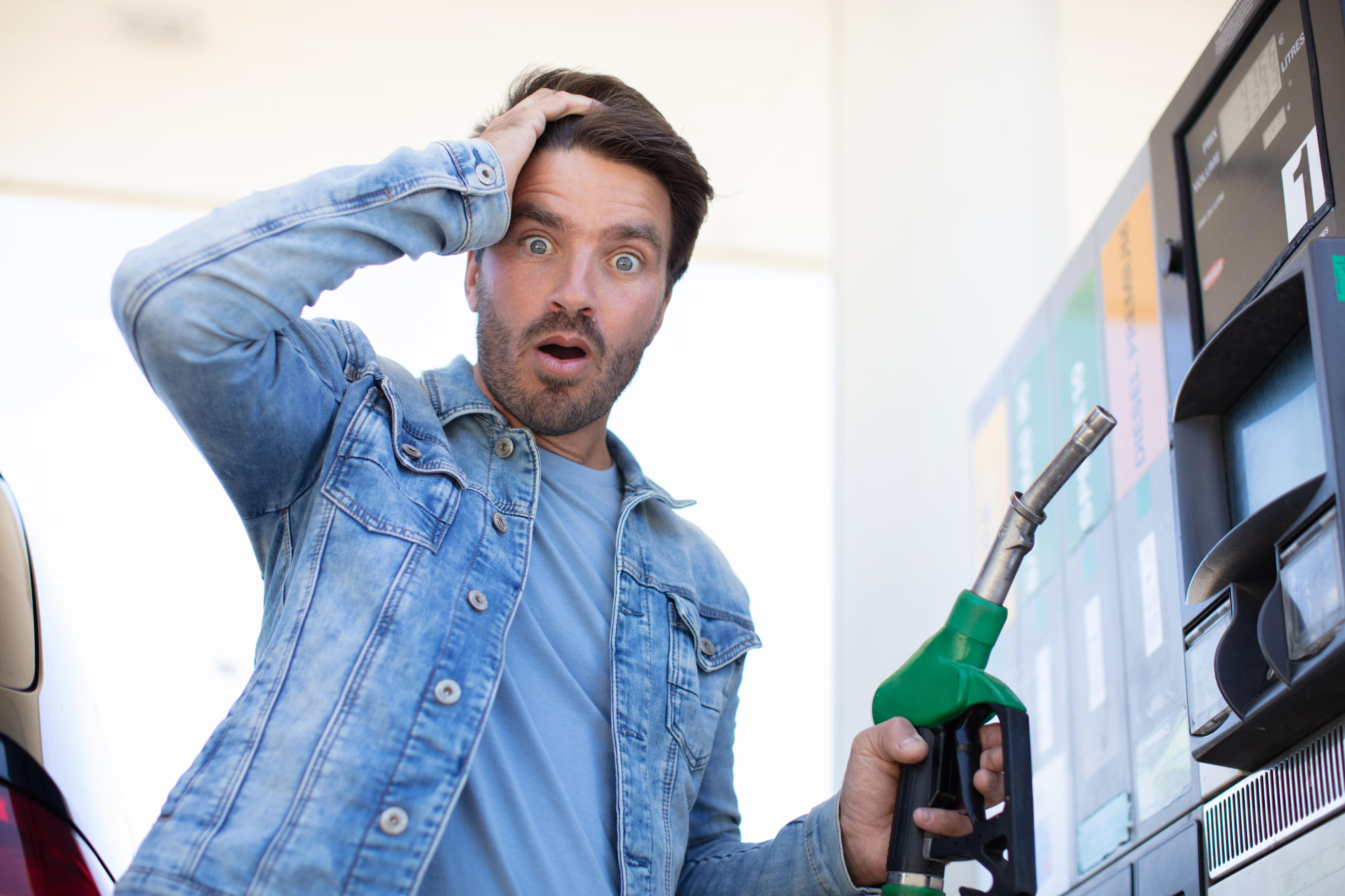 Man confused while fueling